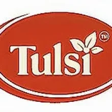 Tulsi brand logo featuring white text and leaf icon on red oval background.